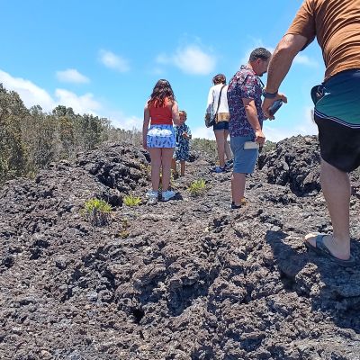 a person standing on a rocky beach