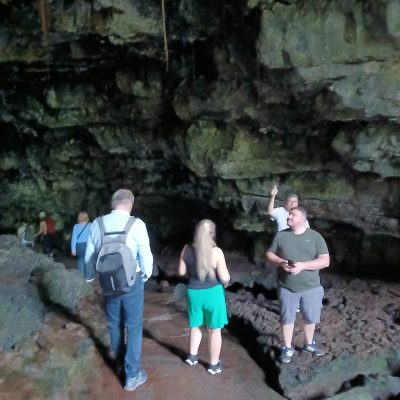 a group of people standing on a rock