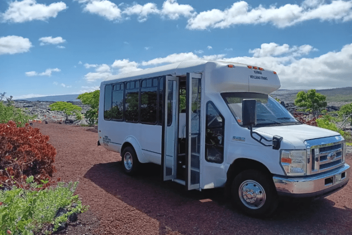 a bus parked on the side of a dirt road
