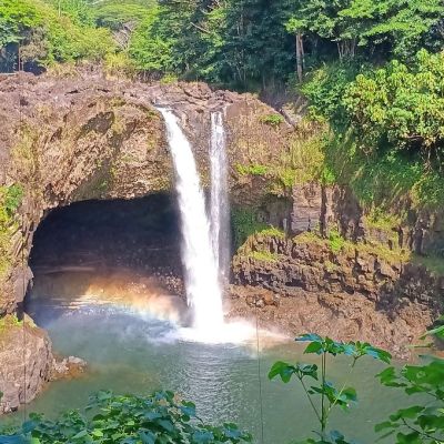 a large waterfall over some water with Rainbow Falls in the background